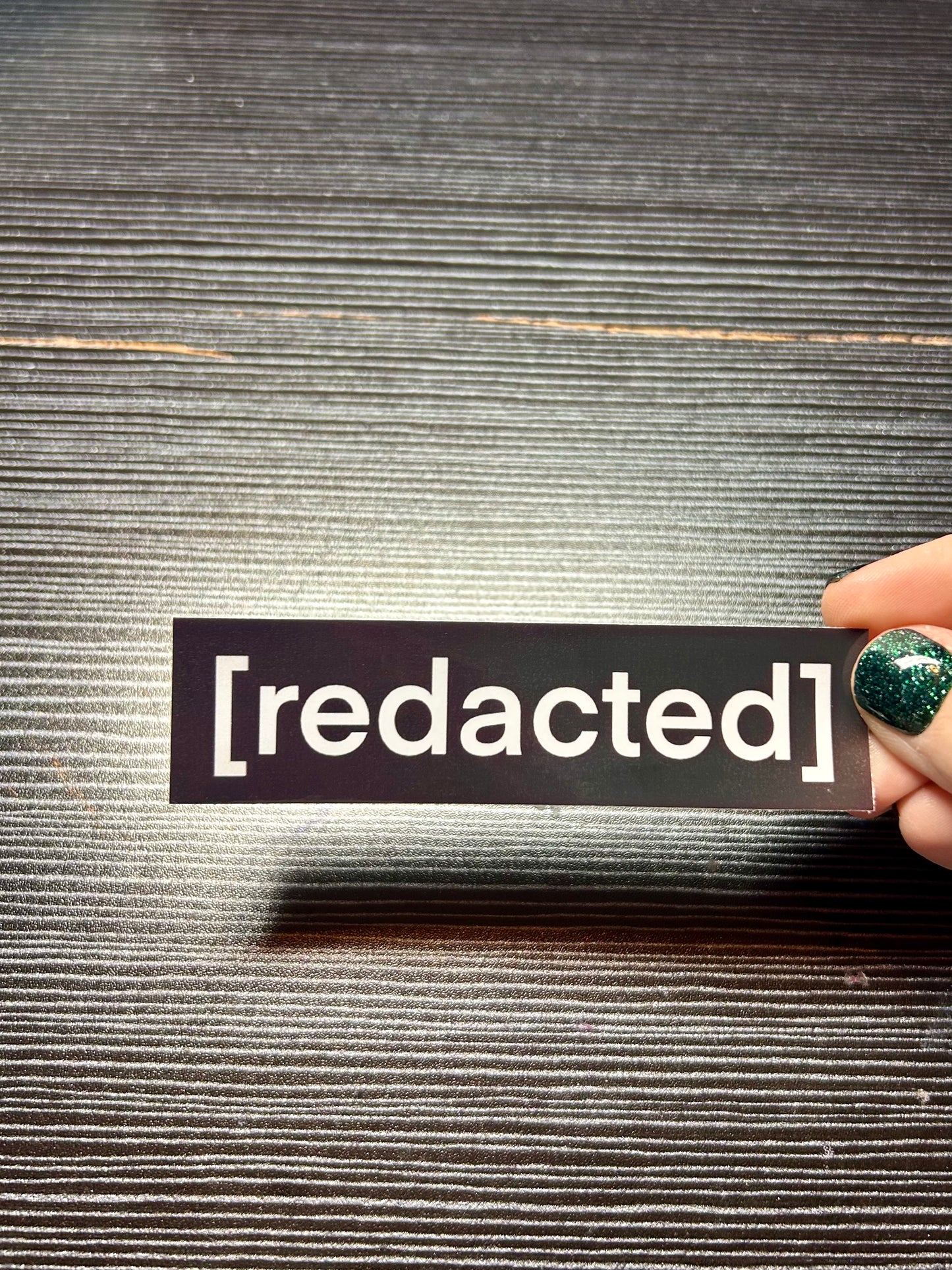 redacted sticker!